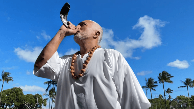 "Apostle Constantine I. Nightingdale leading spiritual transformation, using the shofar to inspire action and leadership in his ministry."