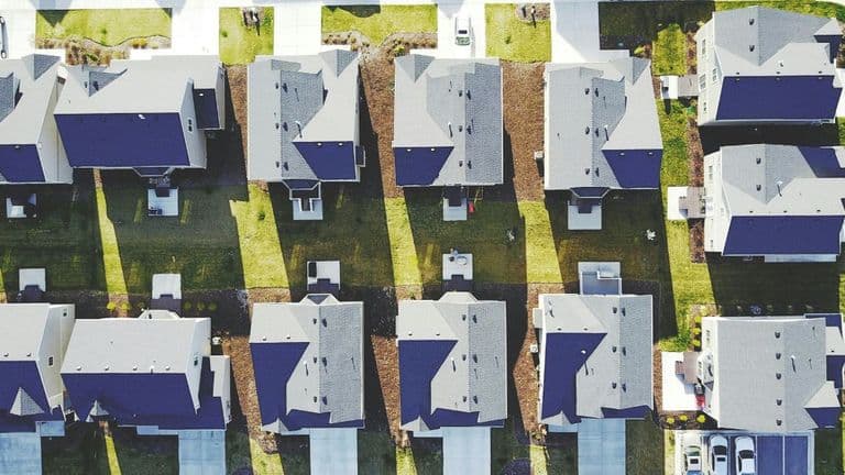 Aerial view of a neighborhood showcasing various houses, highlighting community and connection in urban living.