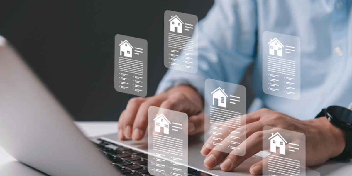 Person typing on a laptop with floating document icons related to real estate.