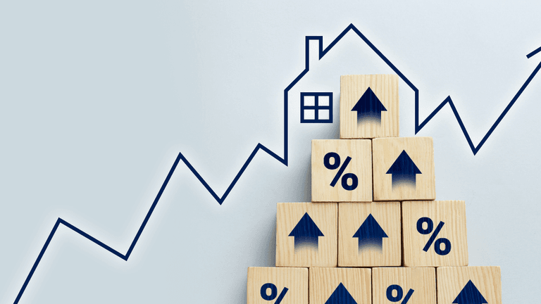 Wooden blocks stacked in a pyramid with upward arrows and a house illustration behind