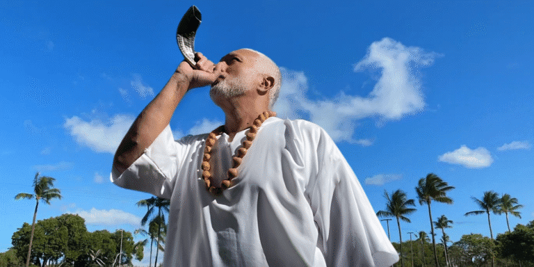 "Apostle Constantine I. Nightingdale leading spiritual transformation, using the shofar to inspire action and leadership in his ministry."